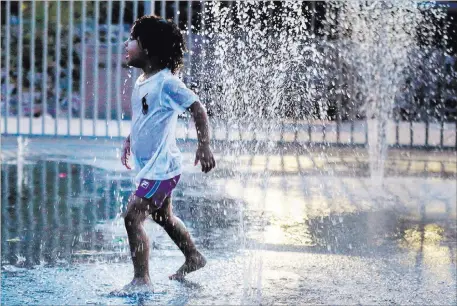  ?? Rachel Aston ?? Las Vegas Review-journal @rookie__rae Calay Barker, 3, plays Sunday in the water park at Lorenzi Park. At 8 p.m., the temperatur­e was still 108 degrees.