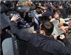  ??  ?? uNreSt: Pro-Russian activists attack police in Odessa yesterday