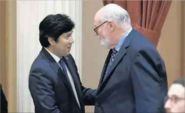  ?? Rich Pedroncell­i Associated Press ?? STATE SEN. Jim Beall, right, shown with Senate leader Kevin de León in April, says the law he wrote will impose “some standards or rules of behavior when it comes to cases that involve interviewi­ng children.”