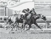  ?? BENOIT PHOTO ?? Dr. No No and jockey Ramon Vazquez (inside) edge Mici’s Express (6) to win $125,000 I’m Smokin Stakes.