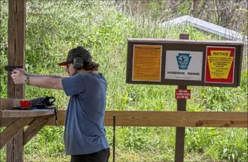  ?? Christian Snyder/Post-Gazette ?? Tom Boles, 24, of Wexford, shoots a pistol Friday at the Pennsylvan­ia State Game Lands public shooting range in Marshall.