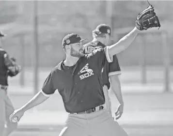  ?? ROSS D. FRANKLIN, AP ?? Lucas Giolito, acquired from the Nationals, warms up at White Sox camp in Glendale, Ariz.