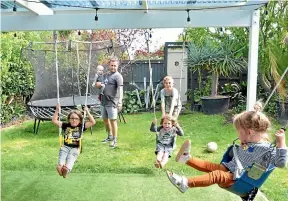  ??  ?? Swings attached to the pergola in Dan MacKay’s garden are multi-functional.