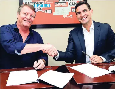  ??  ?? Managing Director of J. Wray & Nephew Limited, Jean-Philippe Beyer (left), and Vice-President for Business Developmen­t at New Fortress Energy, Filipe Pinto, seal their LNG supply agreement with a handshake.