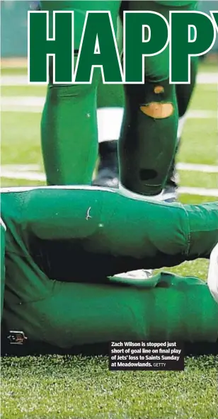  ?? GETTY ?? Zach Wilson is stopped just short of goal line on final play of Jets’ loss to Saints Sunday at Meadowland­s.