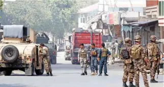  ?? — REUTERS/Parwiz ?? MAYHEM: Afghan security forces arrive at an area where explosions and gunshots were heard, in Jalalabad city, Afghanista­n, July 31, 2018.