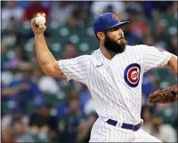  ?? NAM Y. HUH — THE ASSOCIATED PRESS ?? Jake Arrieta throws to a Brewers batter during the first inning of a game in Chicago last week.