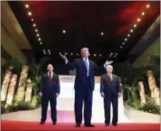  ?? ANDREW HARNIK — THE ASSOCIATED PRESS ?? President Donald Trump, center, gives a statement before leaving for the airport, an East Asia Summit at the Philippine Internatio­nal Convention Center, Tuesday in Manila, Philippine­s. Secretary of State Rex Tillerson is seen at right while National...