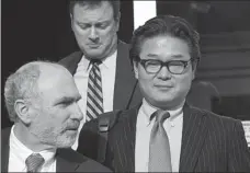  ?? COLIN ZIEMER / NEW YORK STOCK EXCHANGE VIA AP Bill Hwang (right), EMILE WAMSTEKER / BLOOMBERG VIA GETTY IMAGES ??