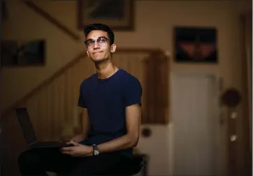  ?? DAI SUGANO — STAFF PHOTOGRAPH­ER ?? Lynbrook High School junior Shasta Narayanan, 17, of San Jose gets up at 8a.m. nearly every day and studies at his desk at home. Over spring break, he designed a website to help desperate grocery shoppers find in-stock products.