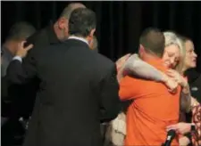  ?? ROBERT RAY - THE ASSOCIATED PRESS ?? Kentucky Gov. Matt Bevin, left, consoles members of the community in Benton, KY., Friday, Jan. 26, 2018. Gov. Bevin spoke of the shooting at the high school that claimed the life of two teenagers and injured 21 others.