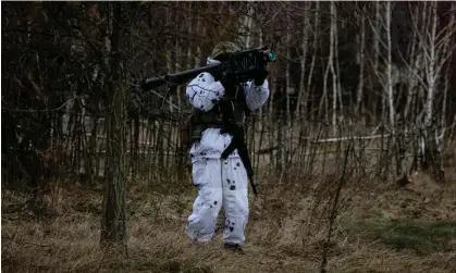  ?? Photograph: Gleb Garanich/Reuters ?? A Ukrainian serviceman holds a Stinger anti-aircraft missile, included in the latest arms package, as he attends drills in February.