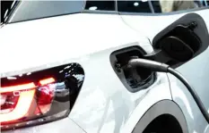  ?? Jeenah Moon/Bloomberg ?? The charging port of a Volkswagen ID.4 electric sports utility vehicle during the 2022 New York Internatio­nal Auto Show in New York.