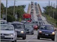  ?? RED HUBER — ORLANDO SENTINEL (VIA AP) ?? People evacuate Merritt Island, Fla., on Wednesday in anticipati­on of Hurricane Matthew.