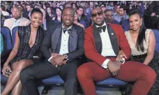  ??  ?? NBA stars Dwyane Wade, center left, and LeBron James enjoy the 2013 ESPY Awards in Los Angeles. JORDAN STRAUSS, INVISION/AP