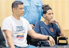  ?? JENNIFER LETT/STAFF PHOTOGRAPH­ER ?? Anthony Borges, 15, who was shot five times on Feb. 14 in the Marjory Stoneman Douglas massacre, remained close to his father, Royer Borges, during a news conference on April 6.