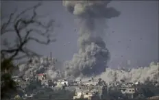  ?? ?? Ariel Schalit/Associated Press
Smoke rises following an Israeli airstrike in the Gaza Strip, as seen from southern Israel on Oct. 23. The United Nations’ top court is hearing a case on Monday that seeks an end of German military and other aid to Israel.