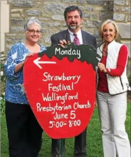  ??  ?? Gail Weaver, Frank Noyes and Nancy Curtis hold a sign welcoming the public to Wallingfor­d Presbyteri­an Church’s Strawberry Festival from 5-8 p.m. June 5. Strawberri­es are just one of the attraction­s at the 64th annual festival bearing their name. The...