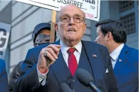  ?? AP PHOTO/JOSE LUIS MAGANA ?? Former mayor of New York Rudy Giuliani speaks during a Dec. 15 news conference outside the federal courthouse in Washington.