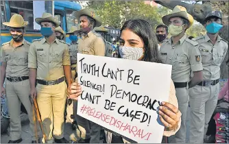  ?? REUTERS ?? A woman holding a placard during a protest against the arrest of climate activist Disha Ravi in Bengaluru.