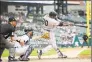  ?? Leon Halip / Getty Images ?? The Yankees’ Edwin Encarnacio­n hits a tworun home run in the third inning against the Tigers at Comerica Park in Detroit on Thursday.