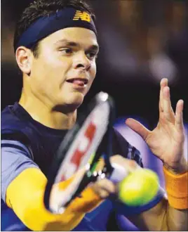  ?? AP PHOTO ?? Milos Raonic plays a forehand return to Andy Murray during their semifinal match at the Australian Open tennis championsh­ips yesterday.