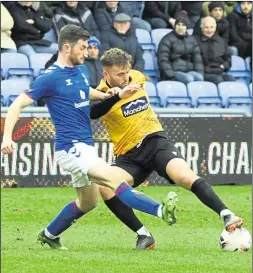  ?? Picture: Steve Terrell ?? Regan Booty attempts to get a foot on the ball against Oldham last weekend