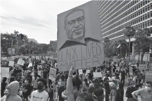  ??  ?? From top: Medical workers at a Los Angeles hospital in December; demonstrat­ors in L.A. in June; Black Lives Matter protesters in L.A. on June 1