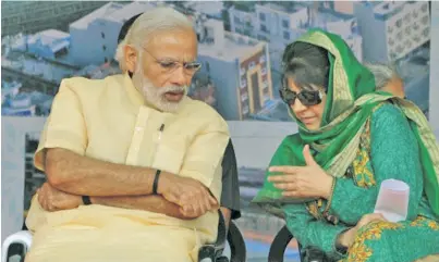  ??  ?? Indian Prime Minister Narendra Modi (left) is seen here with Mehbooba Mufti in 2016.