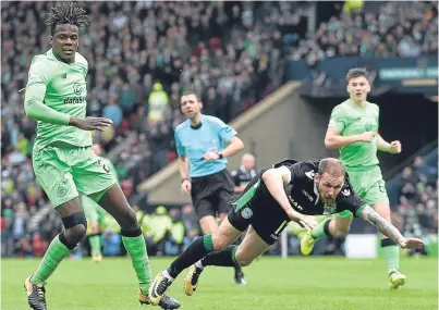  ?? Picture: SNS Group. ?? Hibs’ Martin Boyle goes down under the challenge of Dedryck Boyata which resulted in the penalty kick award.