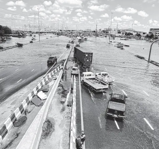  ?? REUTERS ?? Cars are stuck on a flooded road after a rainstorm hit Dubai, in Dubai, United Arab Emirates, April 17.