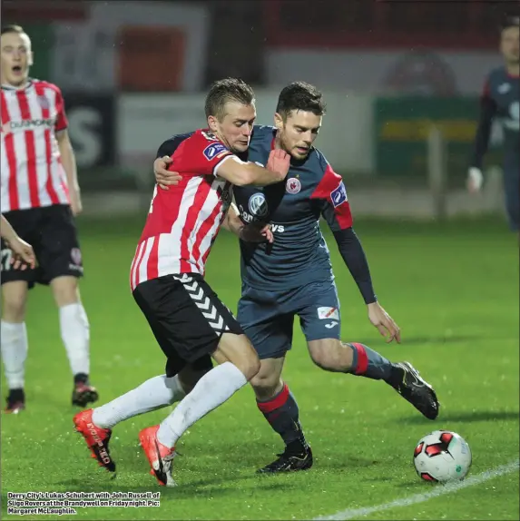  ??  ?? Derry City’s Lukas Schubert with John Russell of Sligo Rovers at the Brandywell on Friday night. Pic: Margaret McLaughlin.