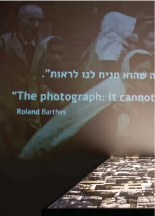  ??  ?? A part of the "Flashes of Memory" exhibition of the photos from the Holocaust is seen at at the Yad Vashem Holocaust memorial in Jerusalem