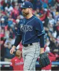  ?? PHIL LONG/AP ?? Tampa Bay pitcher Corey Kluber walks off the field after giving up the game-winning home run to Cleveland’s Oscar Gonzalez in the 15th inning of the Guardians’ wildcard-series clinching victory on Saturday.