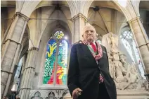  ?? VICTORIA JONES, POOL VIA AP ?? David Hockney stands in front of his stained-glass creation — The Queen’s Window — at Westminste­r Abbey in London.