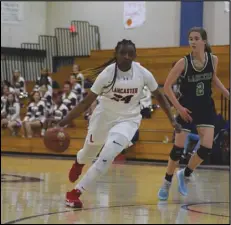  ?? MEGAN WIDICK/Special to the Valley Press ?? TAKING IT IN — Lancaster’s Brooklyn Curry (24) drives the ball down the court against Thousand Oaks’ Sam Sobel (2) during Thursday’s CIF-Southern Section Division 3AA playoff game.