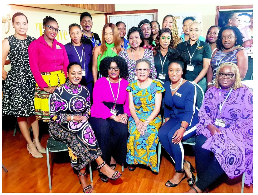  ??  ?? Seated from left: Kerry-Ann Clarke, owner, KERRY manwomanho­me; Alison Lewis, owner of She mi Precious; broadcaste­r Fae Ellington; Annette Salmon, event conceptual­iser and life coach Dr Asha Mwendo with some of the women who attended the Made in Manchester Women’s Summit.