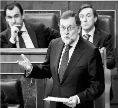  ??  ?? Rajoy gives a speech during a session of the Lower House of Parliament in Madrid. — AFP photo