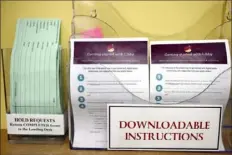  ?? Jessica Hill/Associated Press ?? Instructio­ns for using Libby, a free app for e-books, digital audiobooks and magazines, was on display last month at the Windsor Public Library in Windsor, Conn.