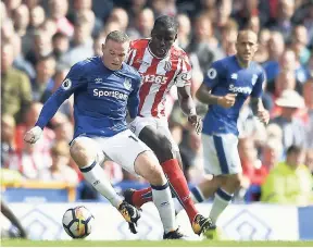  ??  ?? Everton’s Wayne Rooney (left) and Stoke City’s Kurt Zouma in action during the English Premier League football match at Goodison Park, Liverpool, England, yesterday.