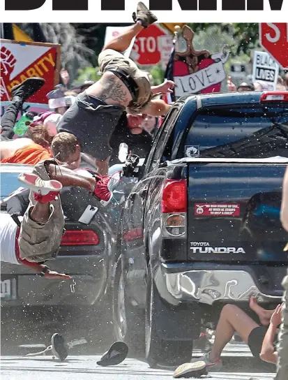  ??  ?? air as the Dodge Challenger ploughs into a crowd of demonstrat­ors in Charlottes­ville