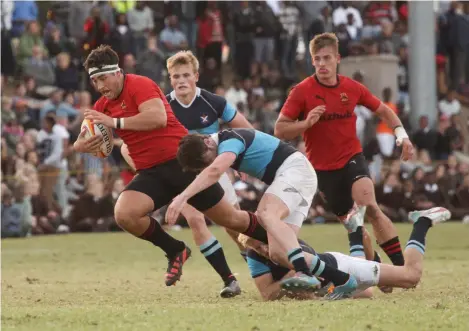  ??  ?? Jimmy Sholto-Douglas (left) is tackled by St Andrew’s players during their 1st rugby clash on City Lords.