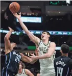  ?? ASSOCIATED PRESS ?? Ersan Ilyasova had 17 points and 14 rebounds in Milwaukee’s 111-100 victory over Orlando Saturday night.