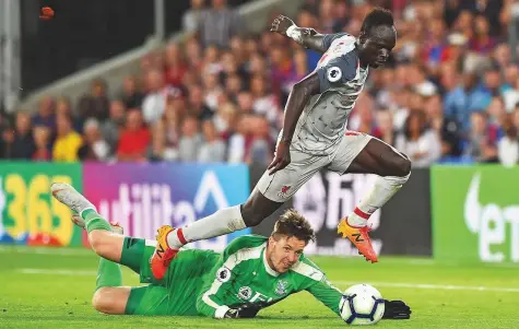  ?? AFP ?? Liverpool’s Senegalese striker Sadio Mane goes around Crystal Palace’s Welsh goalkeeper Wayne Hennessey to score their second goal during the match in the English Premier League at Selhurst Park on Monday.