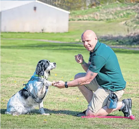  ??  ?? ANIMAL MAGIC: Mike Cairns is founder of the Veteran’s Best Friend charity which pairs rescue dogs with veterans to improve their mental health. He says his dog Sam has been key to his recovery. Picture by Steve Brown.