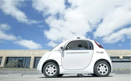  ?? THE ASSOCIATED PRESS FILES ?? In this May 13, 2015, file photo, Google’s new self-driving prototype car is presented during a demonstrat­ion at the Google campus in Mountain View, Calif. Ontario drivers could soon find themselves motoring along the highway next to a car with no one...