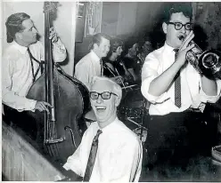  ??  ?? Douglas, centre, played the piano by ear and in his 20s formed and played in dance bands.