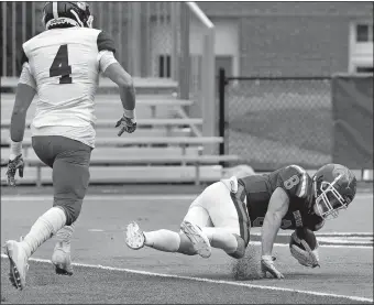  ?? DANA JENSEN/THE DAY ?? Coast Guard’s Justin Moffatt (8) catches a long pass over Springfiel­d’s Kyle Niehr (4) and tumbles into the end zone for a touchdown during the Bears’ 20-14 loss to the Pride on Saturday in New London. Visit www.theday.com to view a photo gallery.