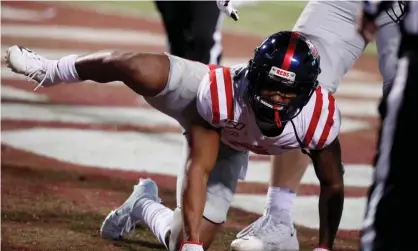  ?? Photograph: Rogelio V Solis/AP ?? Elijah Moore reacts following a touchdown by his team in Starkville, Mississipp­i, on 28 November.