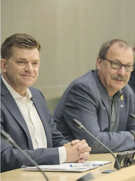  ?? SHAUGHN BUTTS ?? Former Wildrose leader Brian Jean and former Conservati­ve interim leader Ric McIver were seated next to one another Monday at the Federal Building during the first joint meeting as the United Conservati­ve Party. All 22 Wildrose MLAs and seven of the...